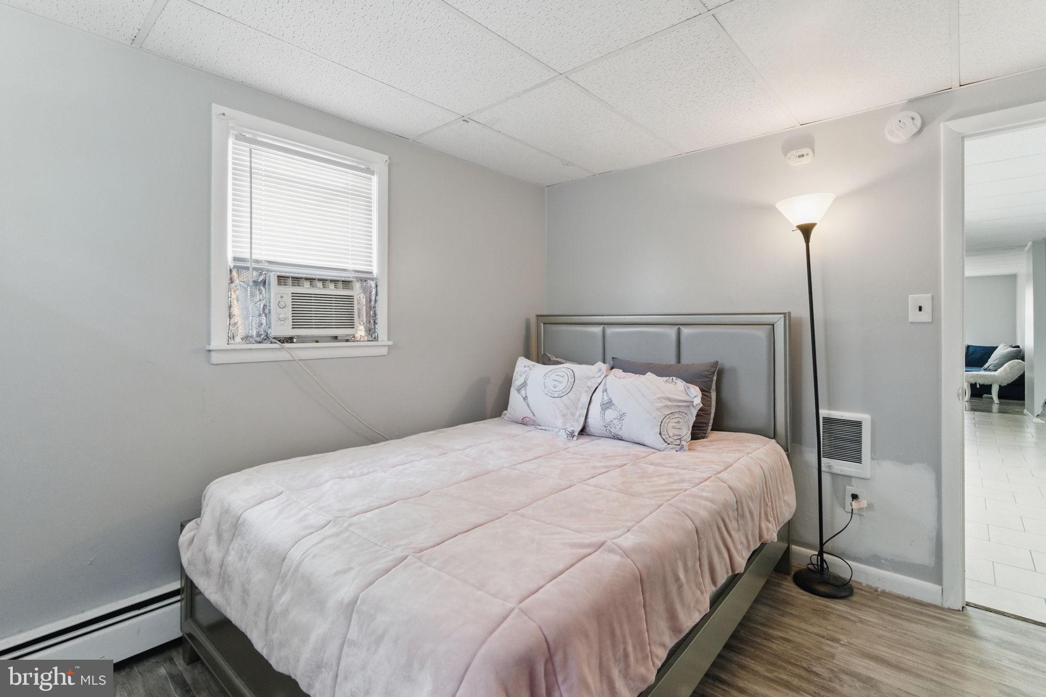 4508 Post Road Marcus Hook, PA 19061 - Photo 18 of 38 a bedroom with a bed and a night stand