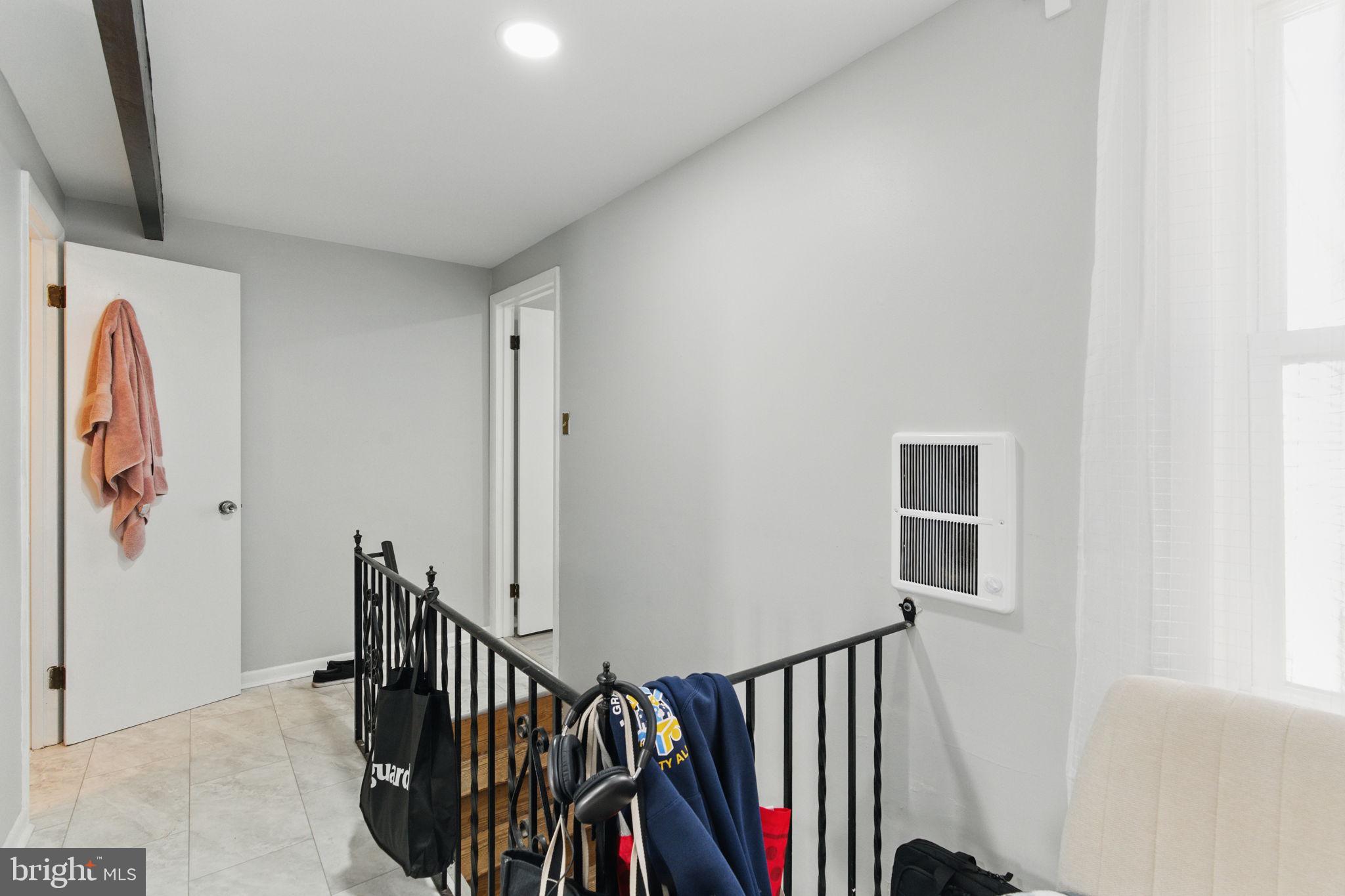 4508 Post Road Marcus Hook, PA 19061 - Photo 26 of 38 a view of hallway with wooden floor and stairs