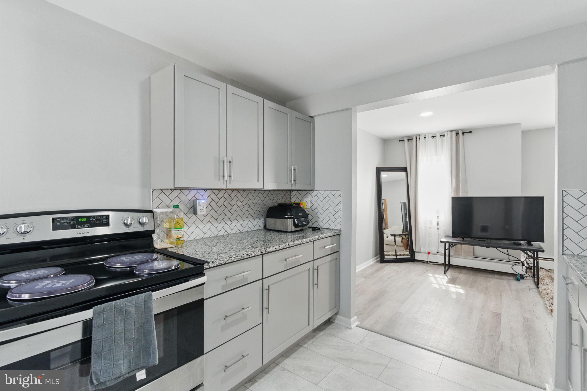 4508 Post Road Marcus Hook, PA 19061 - Photo 28 of 38 a kitchen with a stove and a refrigerator