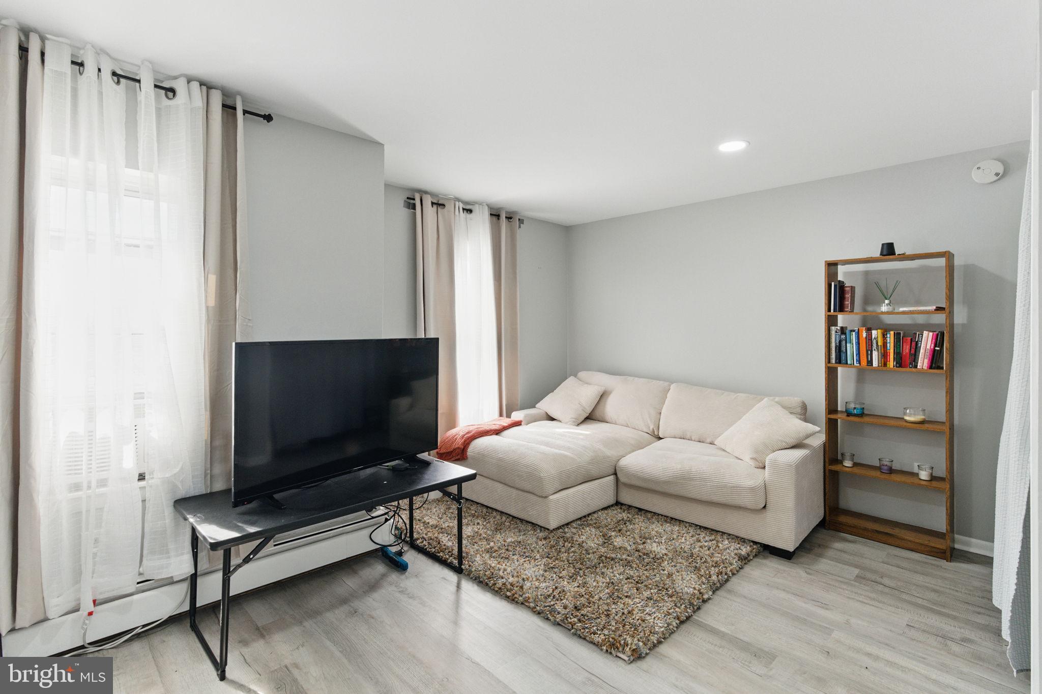 4508 Post Road Marcus Hook, PA 19061 - Photo 31 of 38 a living room with furniture and a flat screen tv