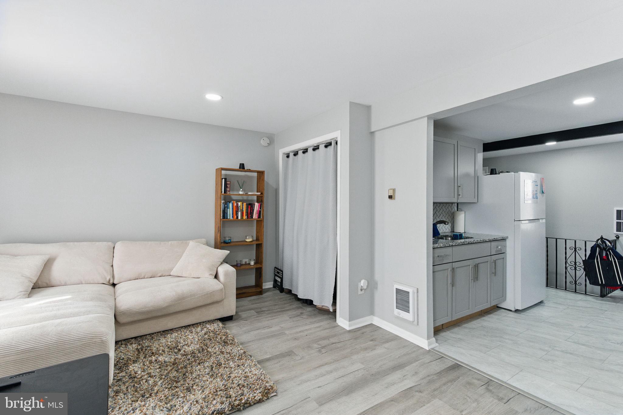 4508 Post Road Marcus Hook, PA 19061 - Photo 32 of 38 a living room with furniture and a kitchen