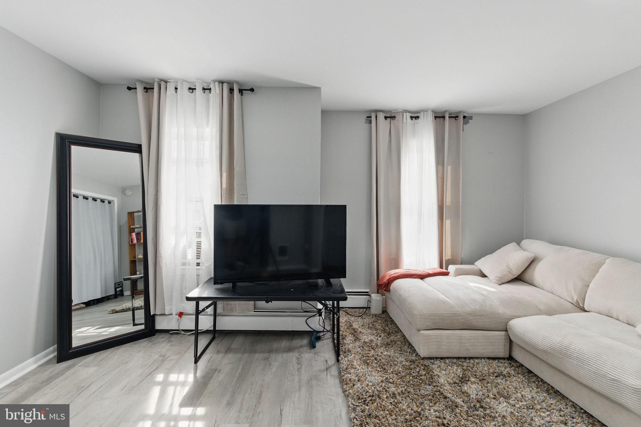 4508 Post Road Marcus Hook, PA 19061 - Photo 4 of 38 a living room with furniture and a flat screen tv