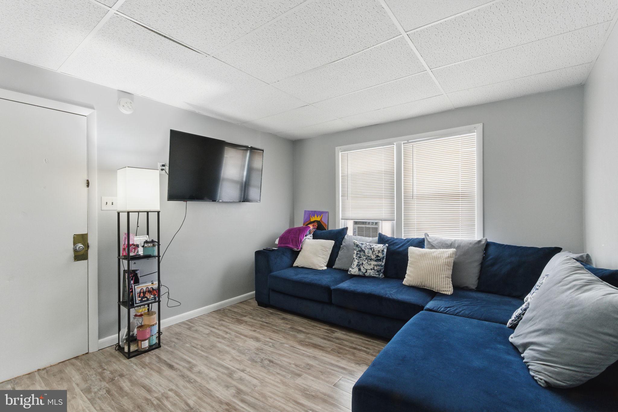4508 Post Road Marcus Hook, PA 19061 - Photo 7 of 38 a living room with furniture and a flat screen tv