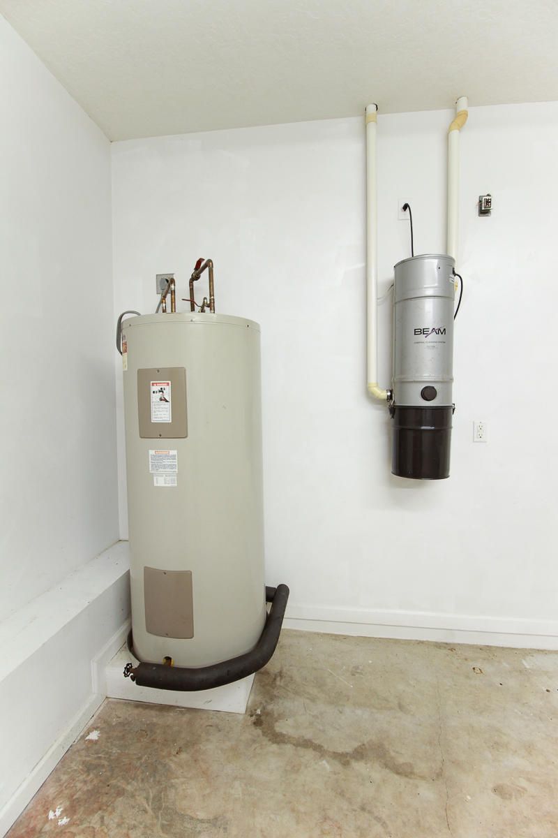 13580 Southeast Ranchland Road Hobe Sound, FL 33455 - Photo 44 of 52 WATER HEATER/CENTRAL VAC