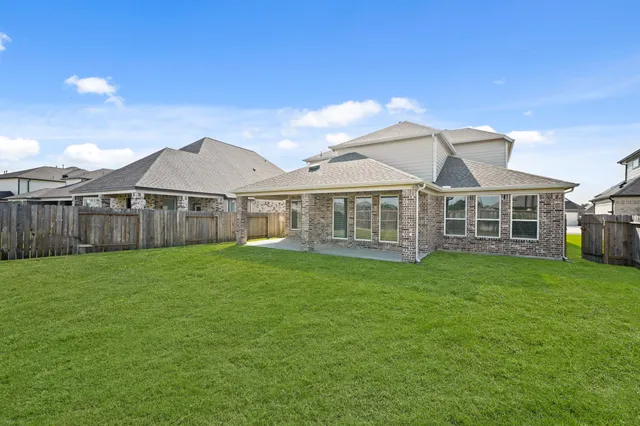 a view of a yard with a house and a garden