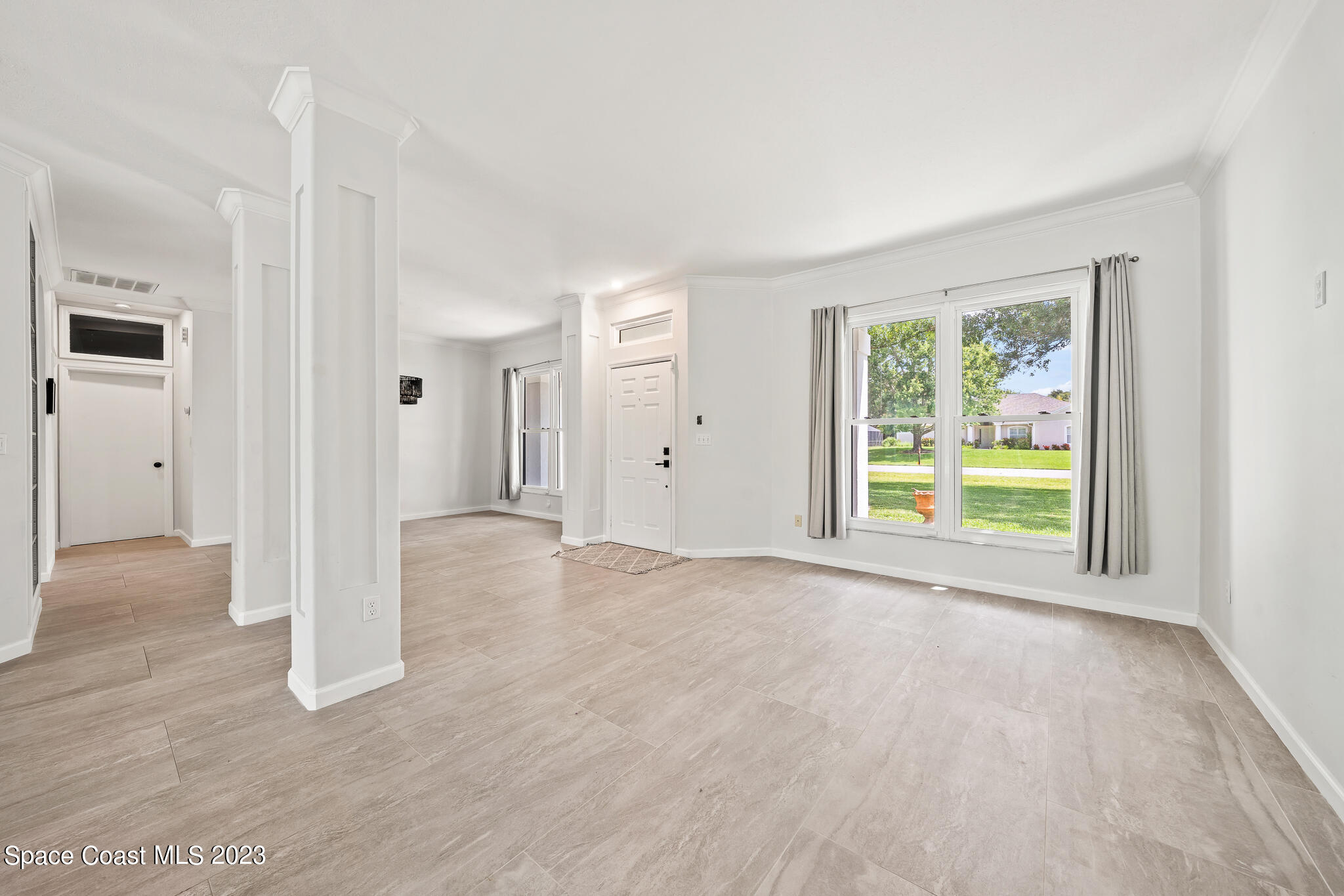 4548 Canard Road Melbourne, FL 32934 - Photo 5 of 44 an empty room with windows and closet