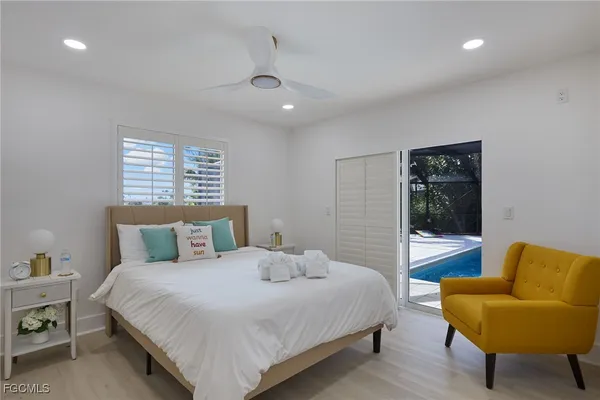 a bedroom with a bed and a couch