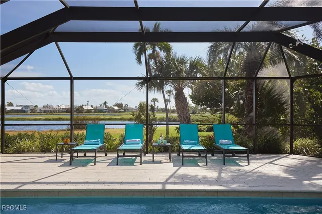 a view of swimming pool with a patio