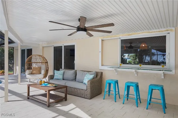 a view of a chairs and table in the patio