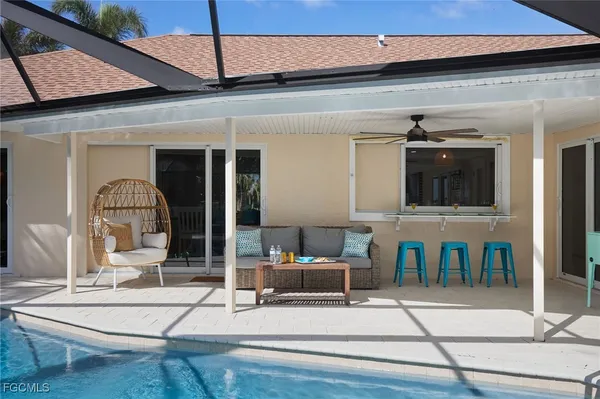 a front view of a house with a yard and a garage