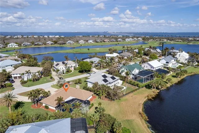 an aerial view of a house with a swimming pool