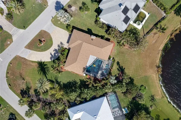 an aerial view of a houses with a lake view