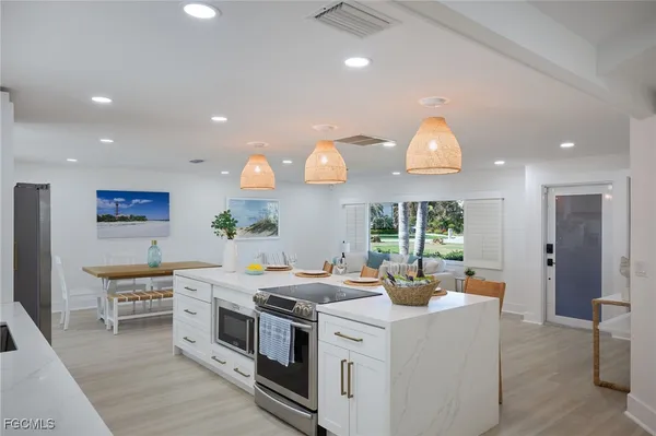 a kitchen with stainless steel appliances a stove oven and a refrigerator