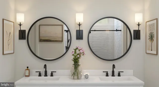 a bathroom with a sink a mirror and a mirror