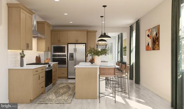 a view of a kitchen with cabinets and stainless steel appliances
