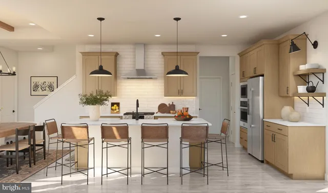 a kitchen with stainless steel appliances kitchen island granite countertop a sink and cabinets