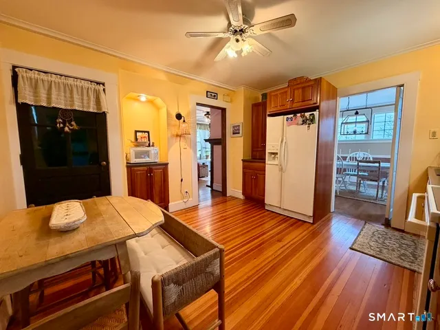 a living room with a couch and wooden floor