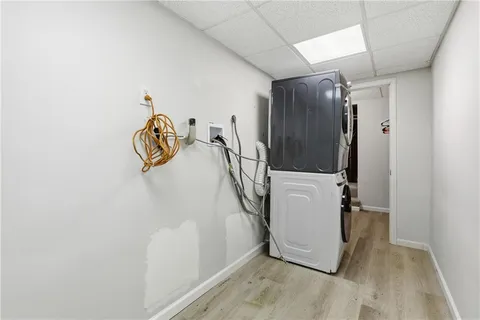 a view of a storage & utility room with a washer dryer