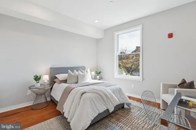 a bedroom with bed and a window