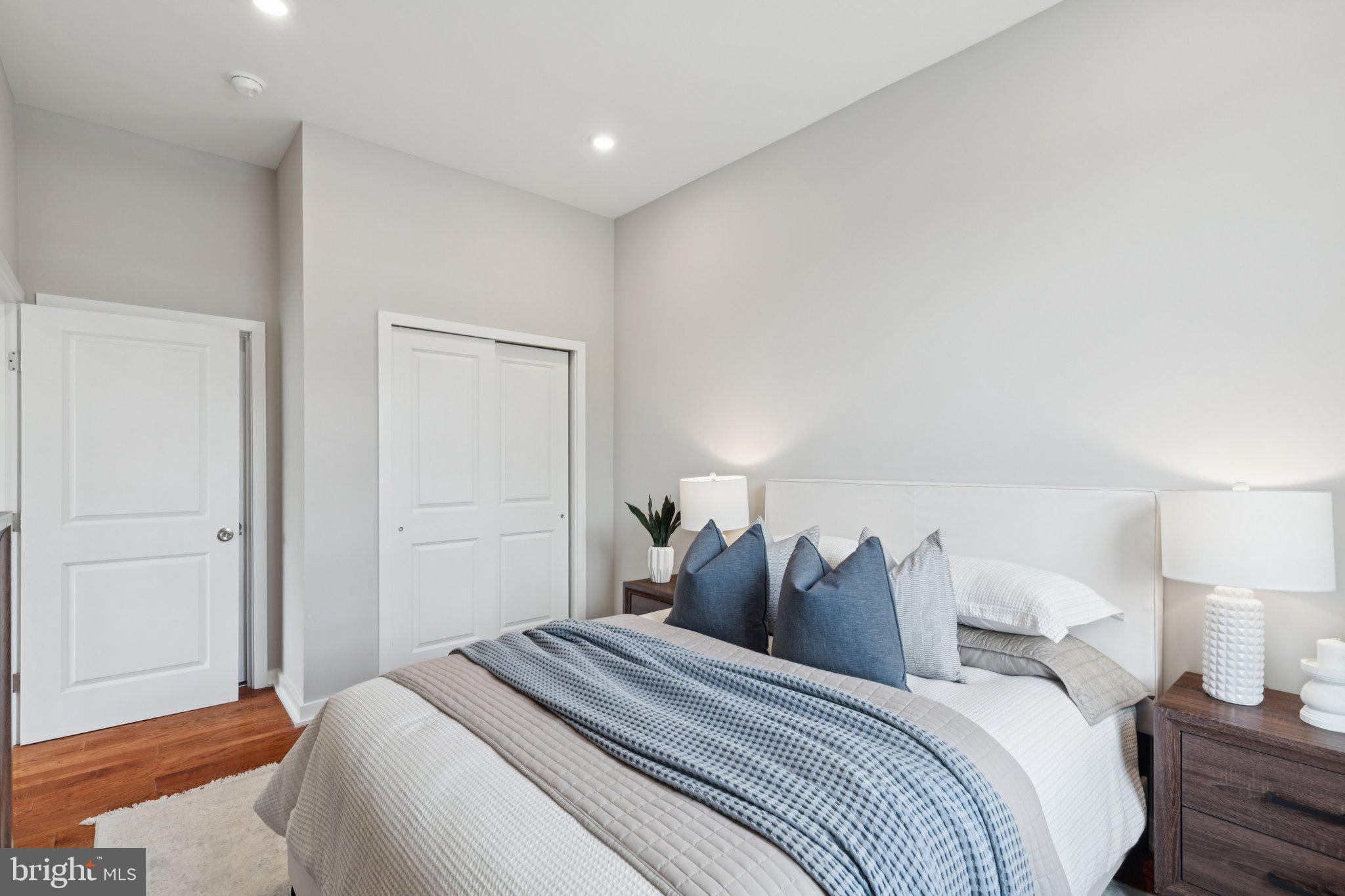 100 Forrest Avenue, Unit 302 Narberth, PA 19072 - Photo 6 of 9 a bed room with a bed and a night stand