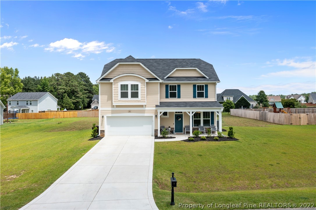 284 Mill Ridge Court Godwin, NC 28344 - Photo 2 of 3 a front view of a house with garden