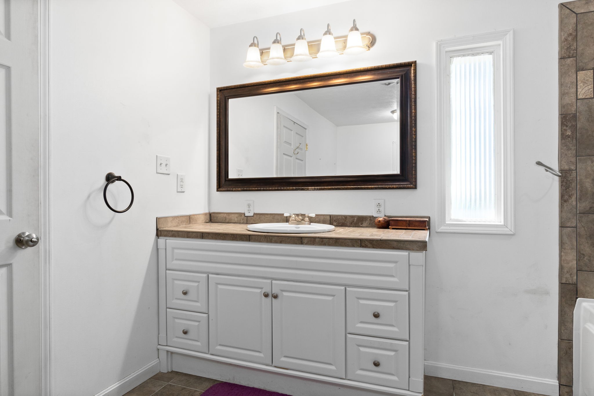 5150 Cadiz Road Hopkinsville, KY 42240 - Photo 27 of 45 a bathroom with a sink vanity and mirror