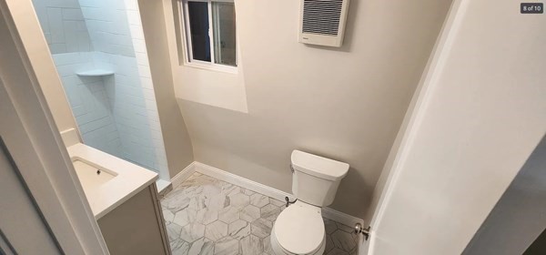 322 Brownell Street, Unit 3W Fall River, MA 02720 - Photo 6 of 10 a white toilet sitting next to a shower