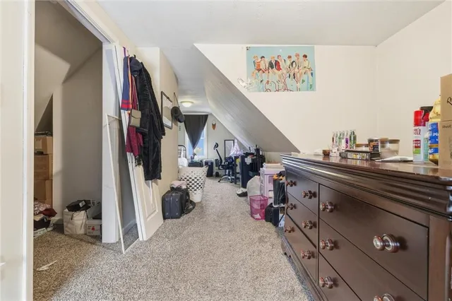 a view of a workspace with furniture and flat screen tv