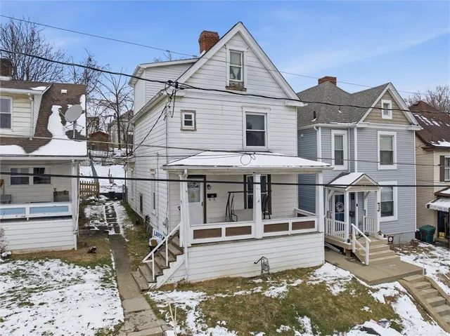 a aerial view of houses with outdoor space