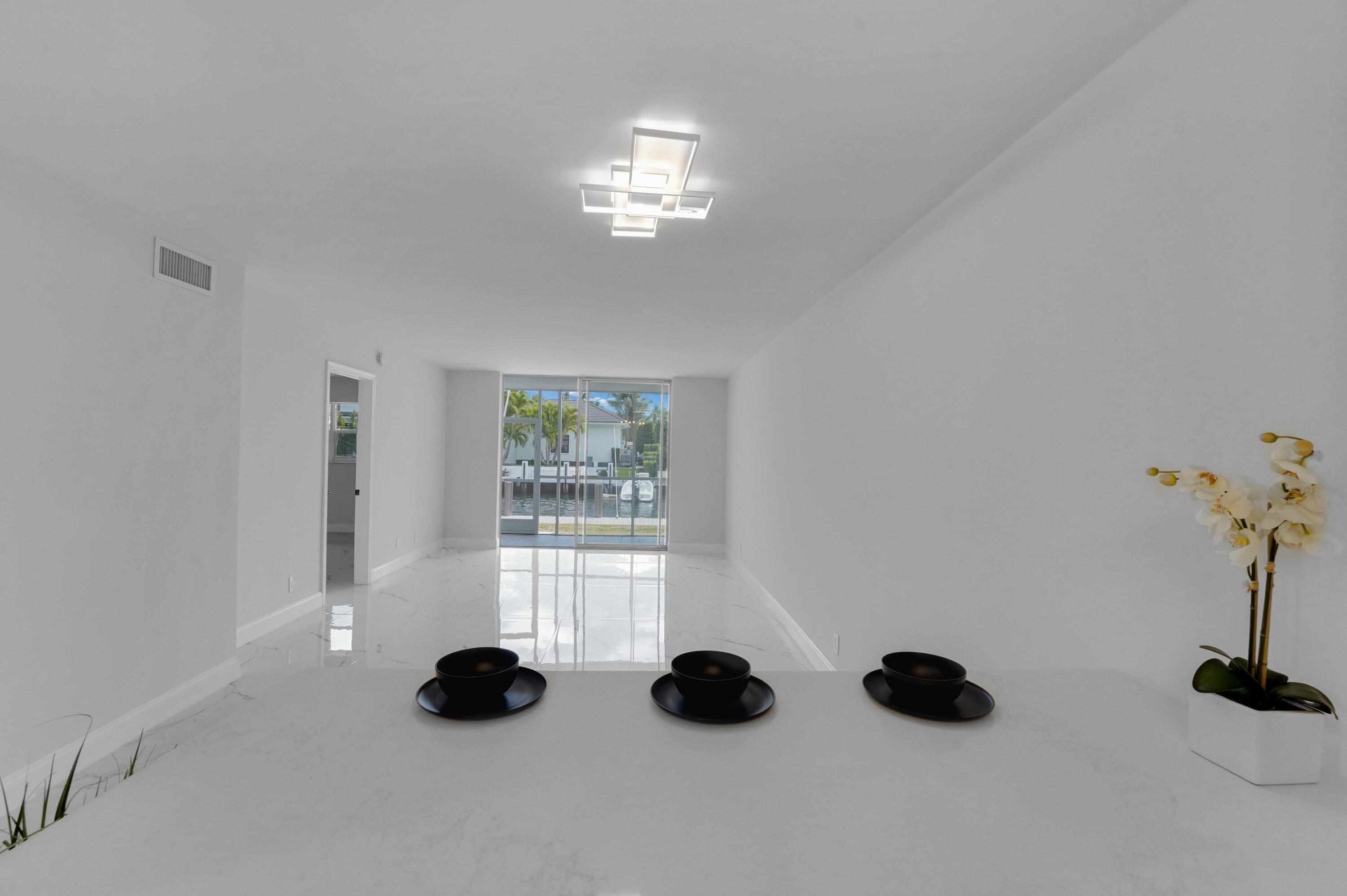 750 Northeast Spanish River Boulevard, Unit 102 Boca Raton, FL 33431 - Photo 14 of 42 a view of entryway and chandelier fan