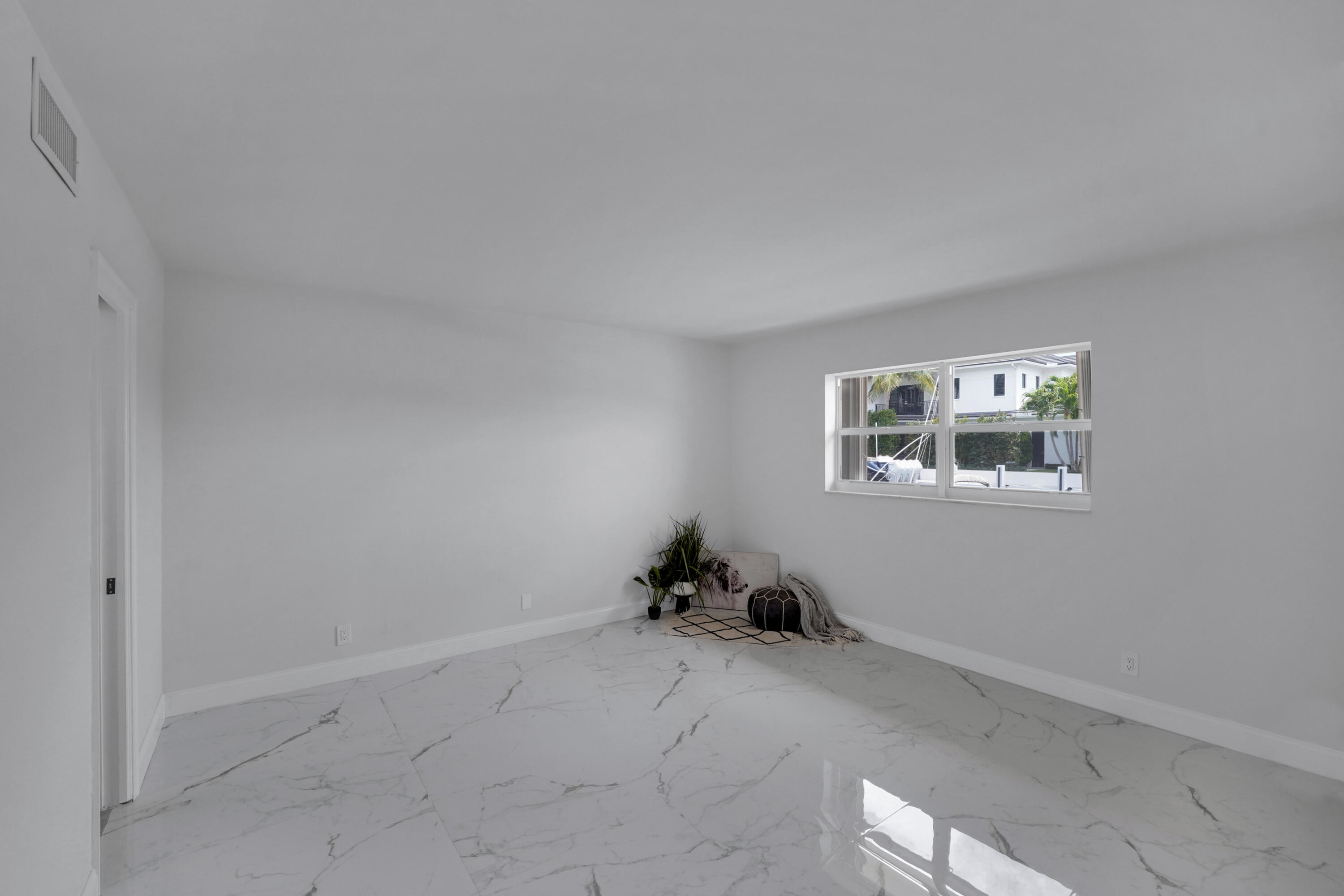 750 Northeast Spanish River Boulevard, Unit 102 Boca Raton, FL 33431 - Photo 18 of 42 a room with a window and a window