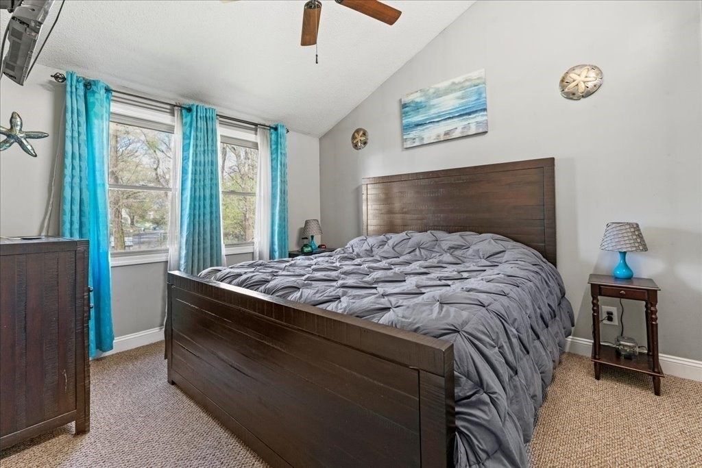 160 University Street Springfield, MA 01104 - Photo 11 of 30 a bedroom with a bed and a painting on the wall