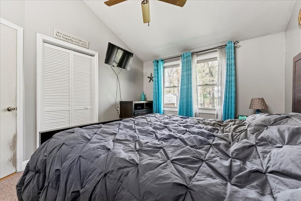 160 University Street Springfield, MA 01104 - Photo 12 of 30 a bed sitting in a bedroom next to a window