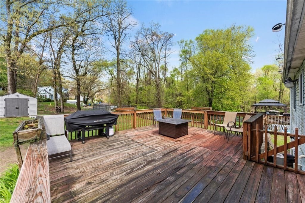 160 University Street Springfield, MA 01104 - Photo 23 of 30 a view of a chairs and table on the wooden deck