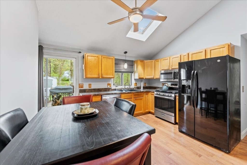 160 University Street Springfield, MA 01104 - Photo 7 of 30 a kitchen with stainless steel appliances granite countertop a refrigerator a sink a stove and island