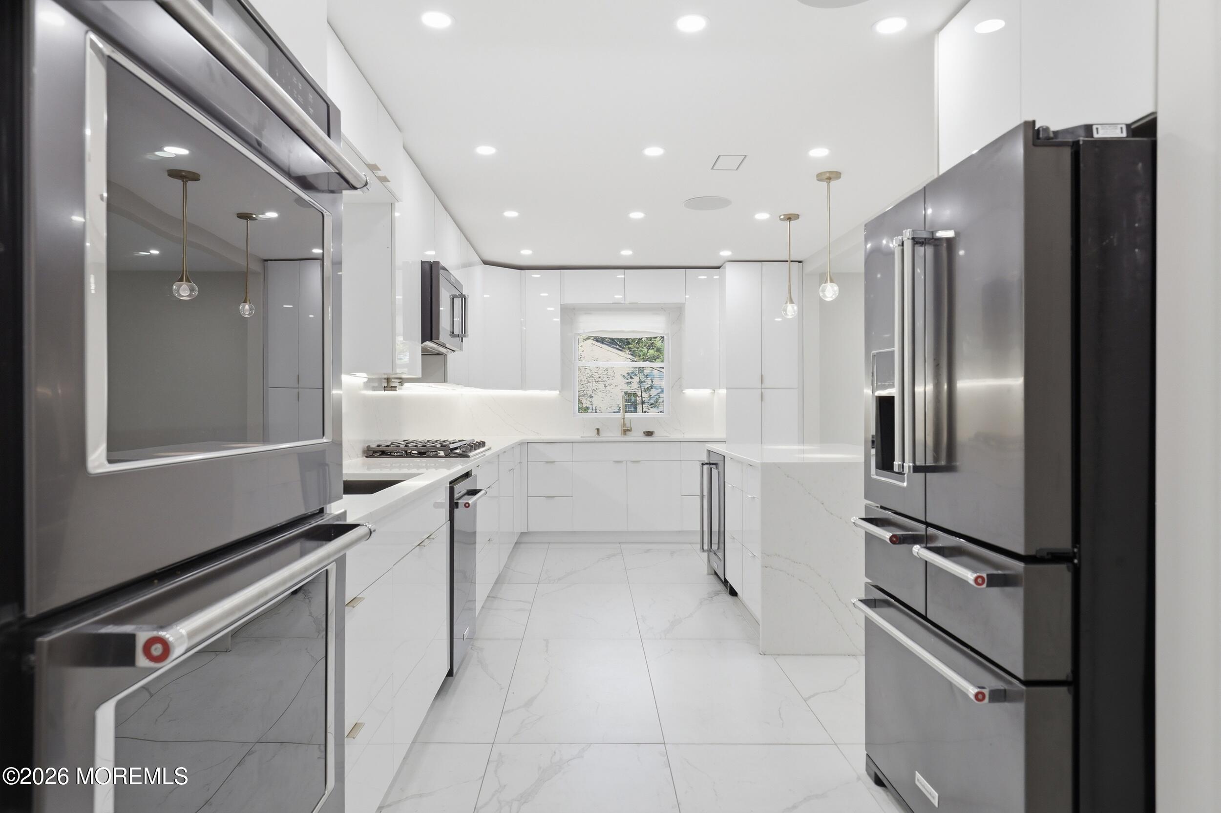 492 Cobain Road Jackson, NJ 08527 - Photo 21 of 47 a kitchen with a refrigerator sink and cabinets