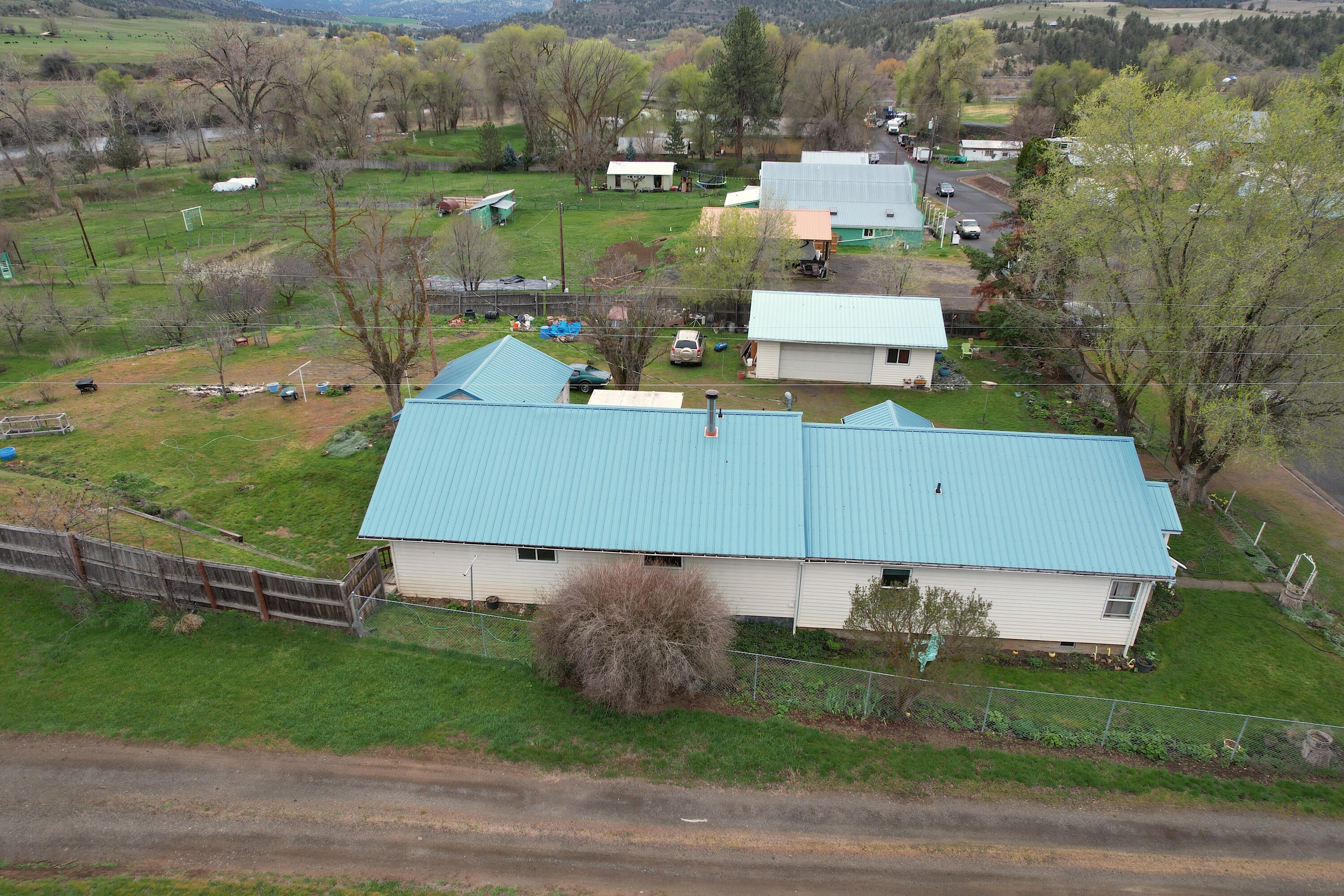 298 Main Street Monument, OR 97864 - Photo 63 of 66 an aerial view of a house with a yard