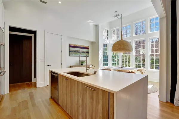 a kitchen with stainless steel appliances granite countertop a sink and a stove