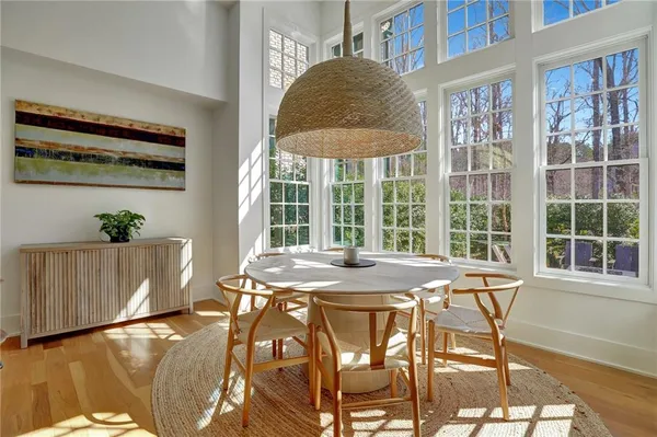 a view of a dining room with furniture and window