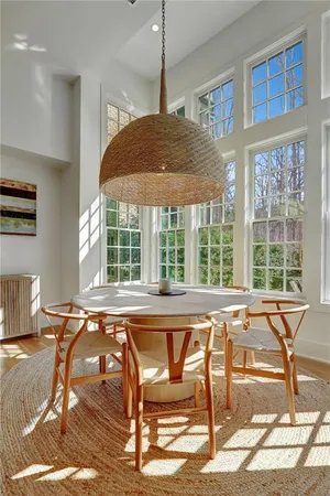 a view of a dining room with furniture window and outside view