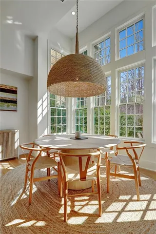a view of a dining room with furniture window and outside view