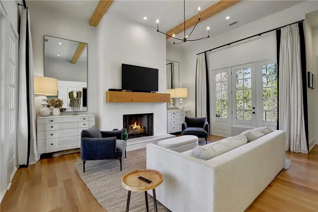 a living room with furniture fireplace and a flat screen tv