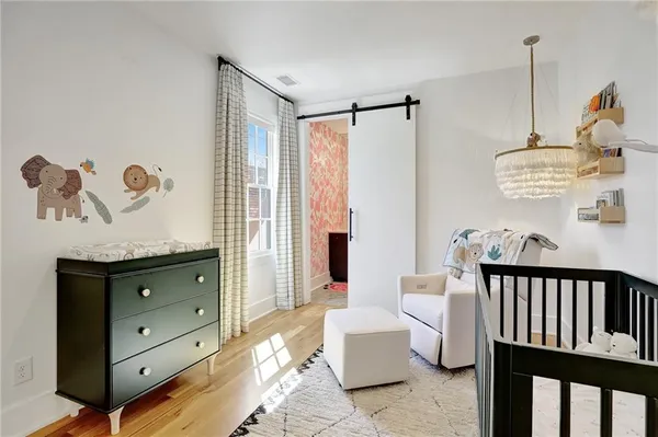 a bedroom with furniture and a window