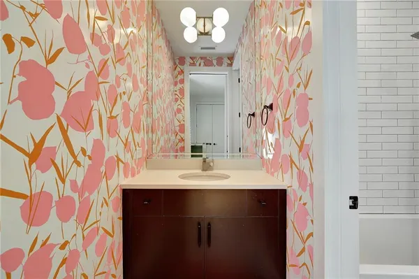 a bathroom with a sink and a mirror