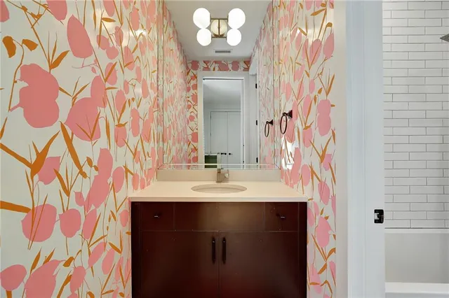 a bathroom with a sink and a mirror