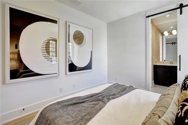 a bedroom with a bed and a mirror