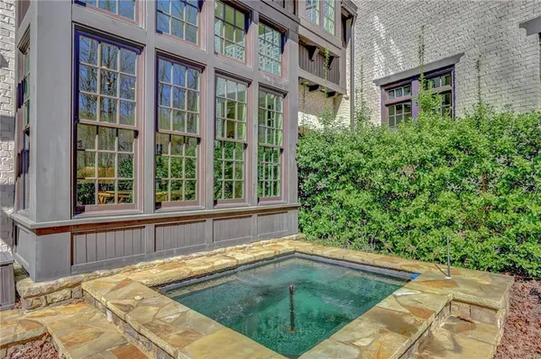 a view of a house with swimming pool