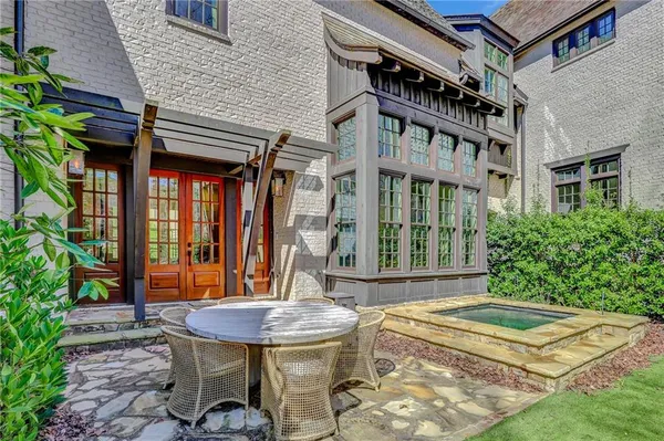 a view of a chairs and table in a patio