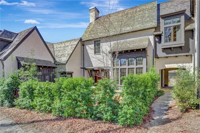 front view of a house with a small yard