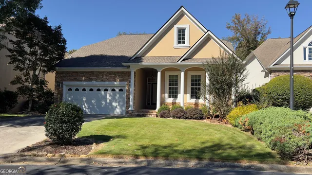 a front view of a house with garden